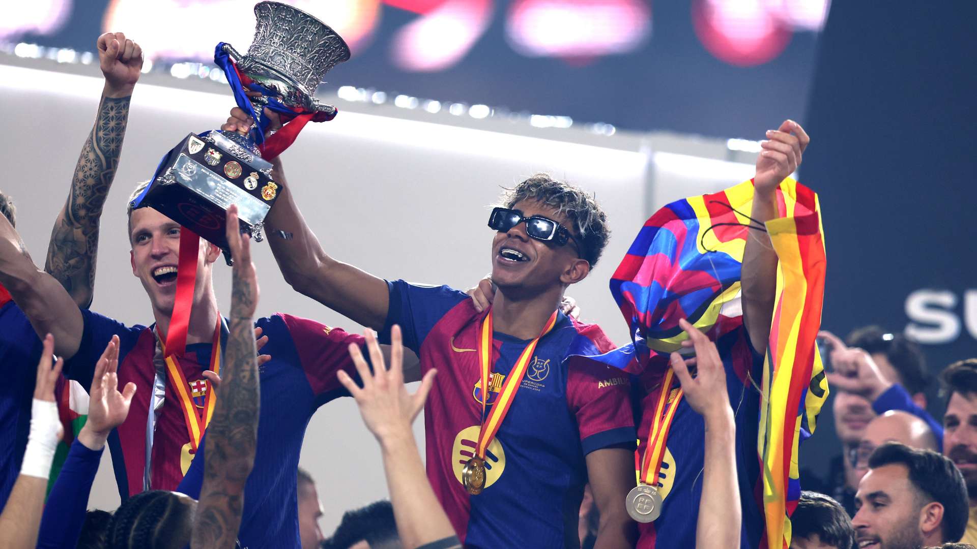 Lamine Yamal of FC Barcelona celebrates with the Supercopa de Espana trophy