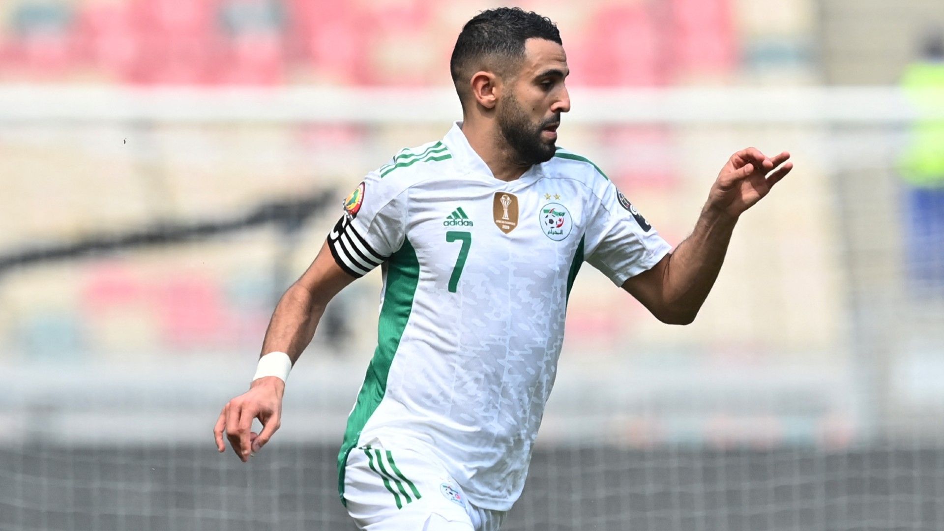 Algeria's forward Riyad Mahrez runs with the ball 