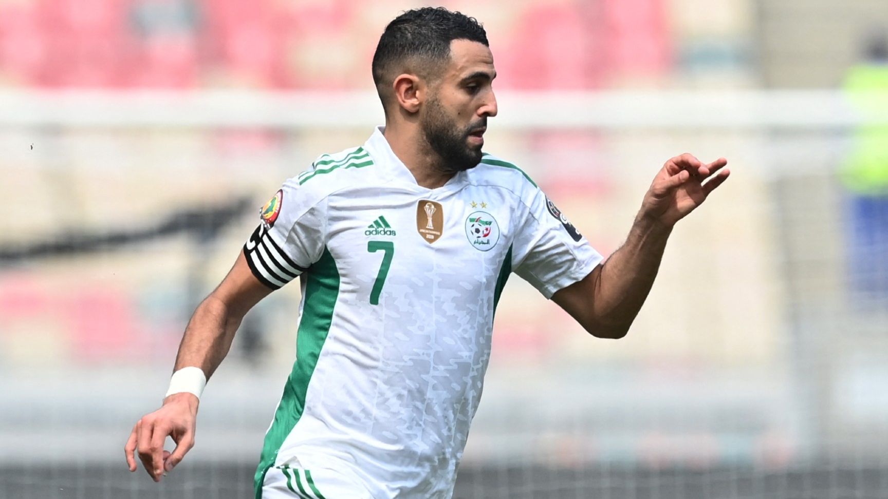 Algeria's forward Riyad Mahrez runs with the ball 