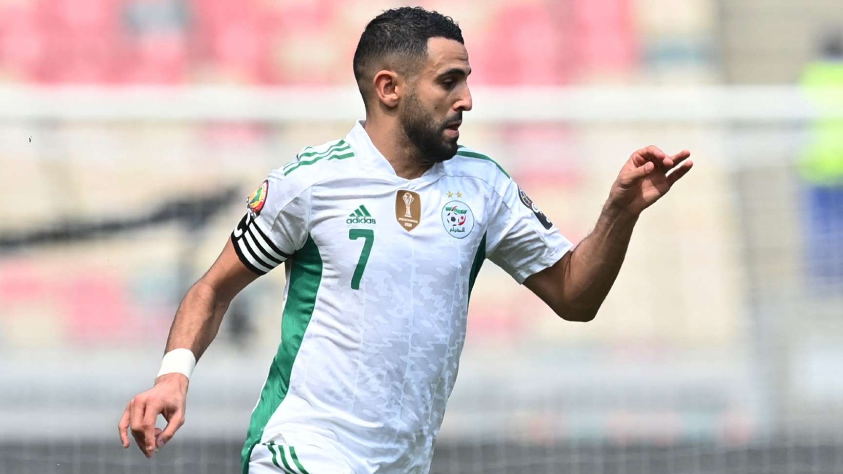 Algeria's forward Riyad Mahrez runs with the ball 