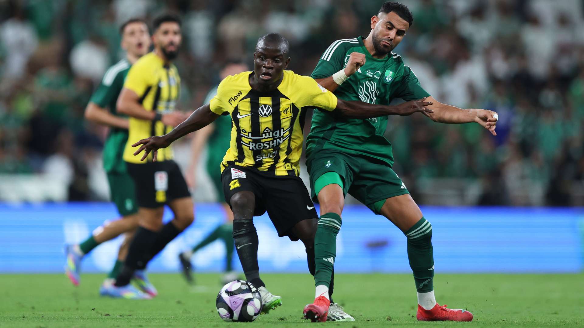 Ngolo Kante of Al Ittihad is challenged by Riyad Mahrez of Al Ahli