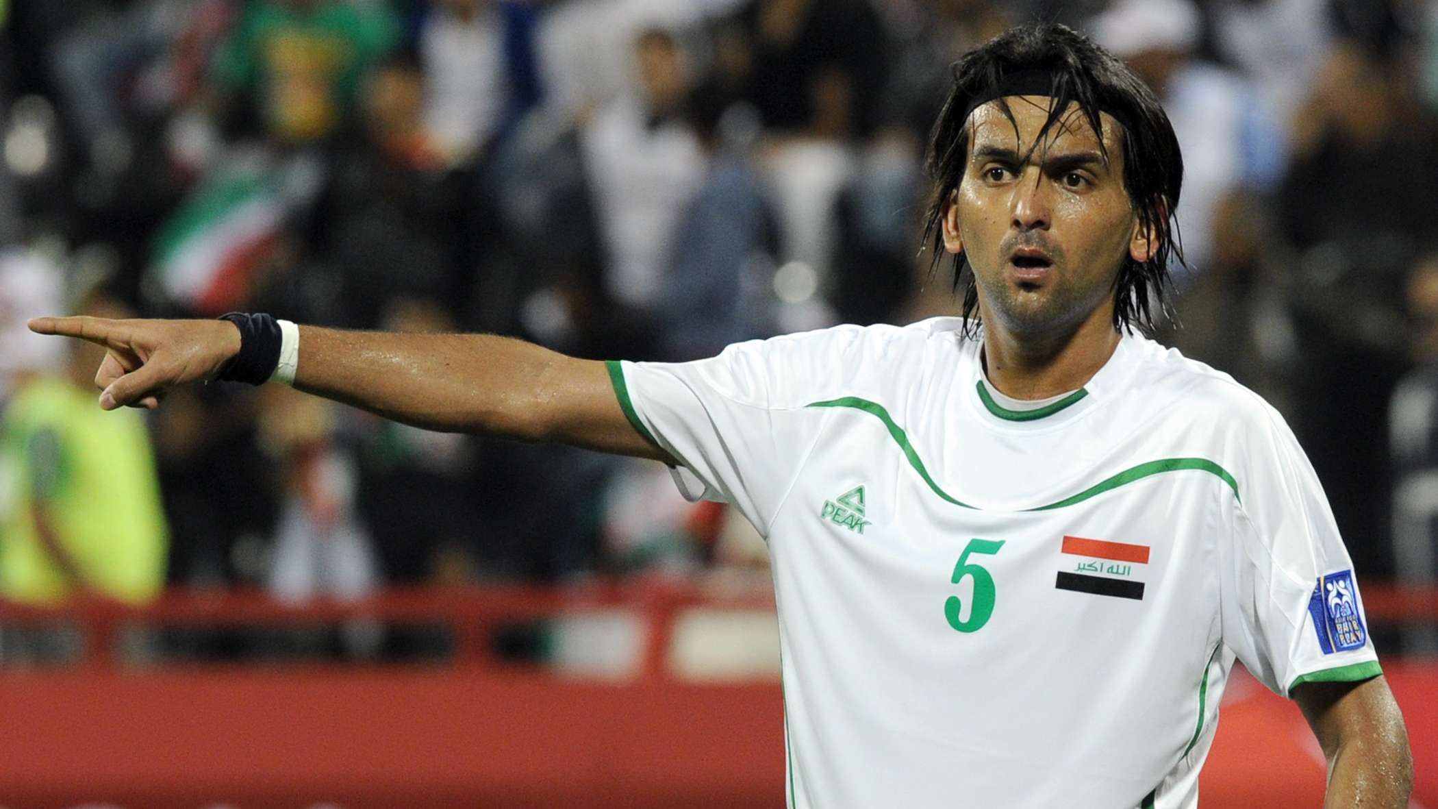 Iraq's midfielder Nashat Akram gestures
