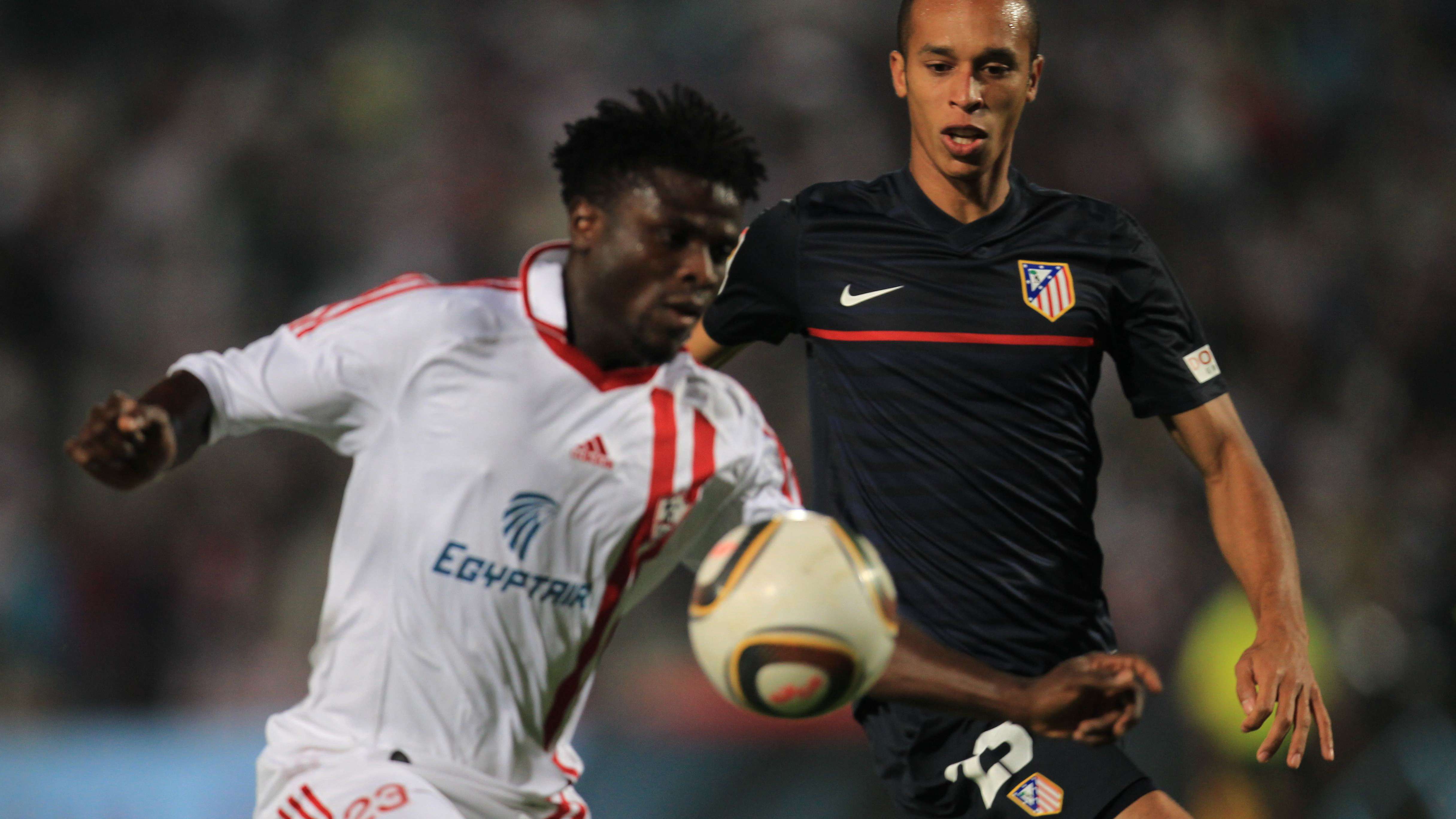 Egyptian footballer Razak Omotoyossi (L)