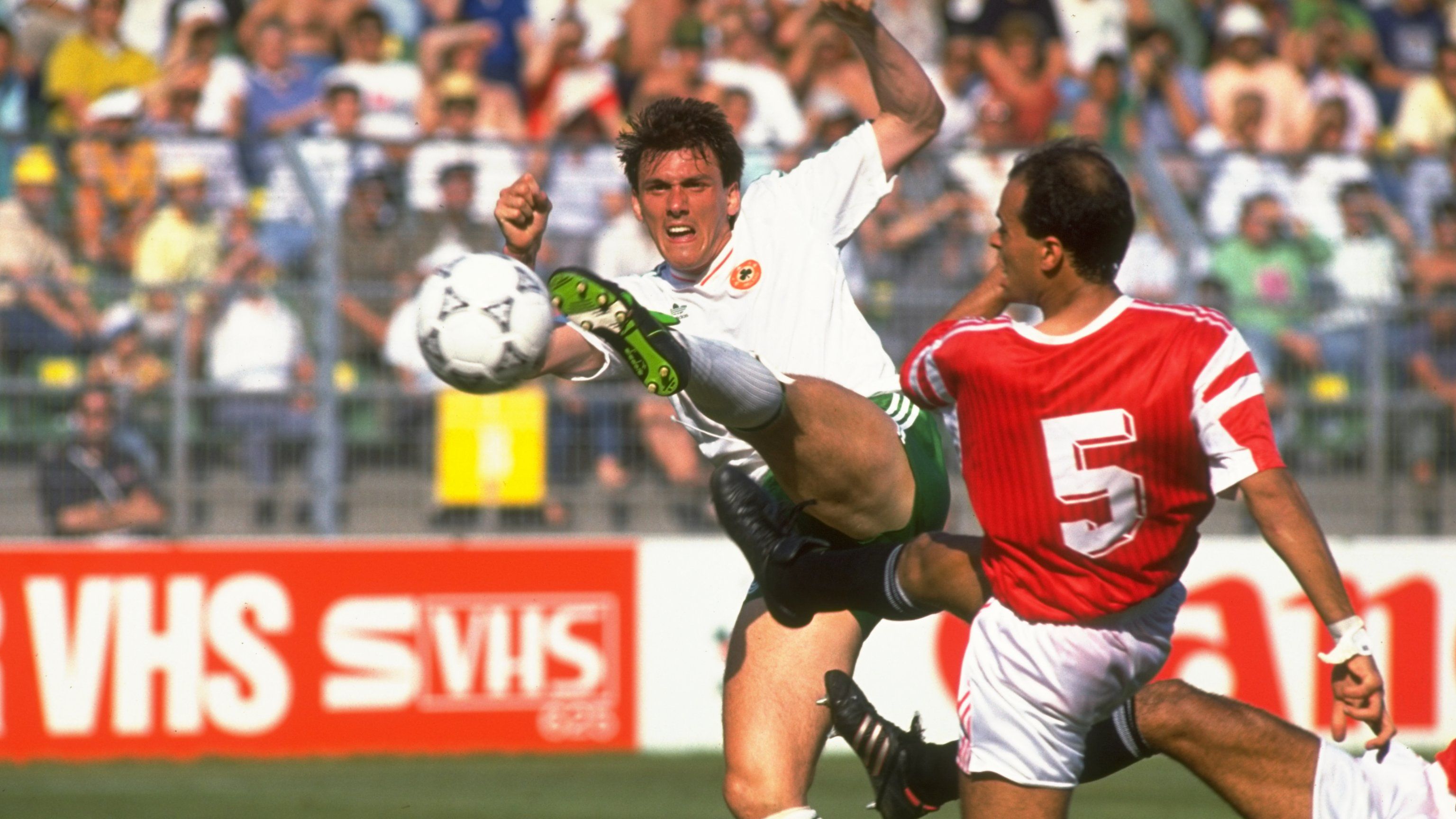 Tony Cascarino of Eire and Hesham Yakan of Egypt