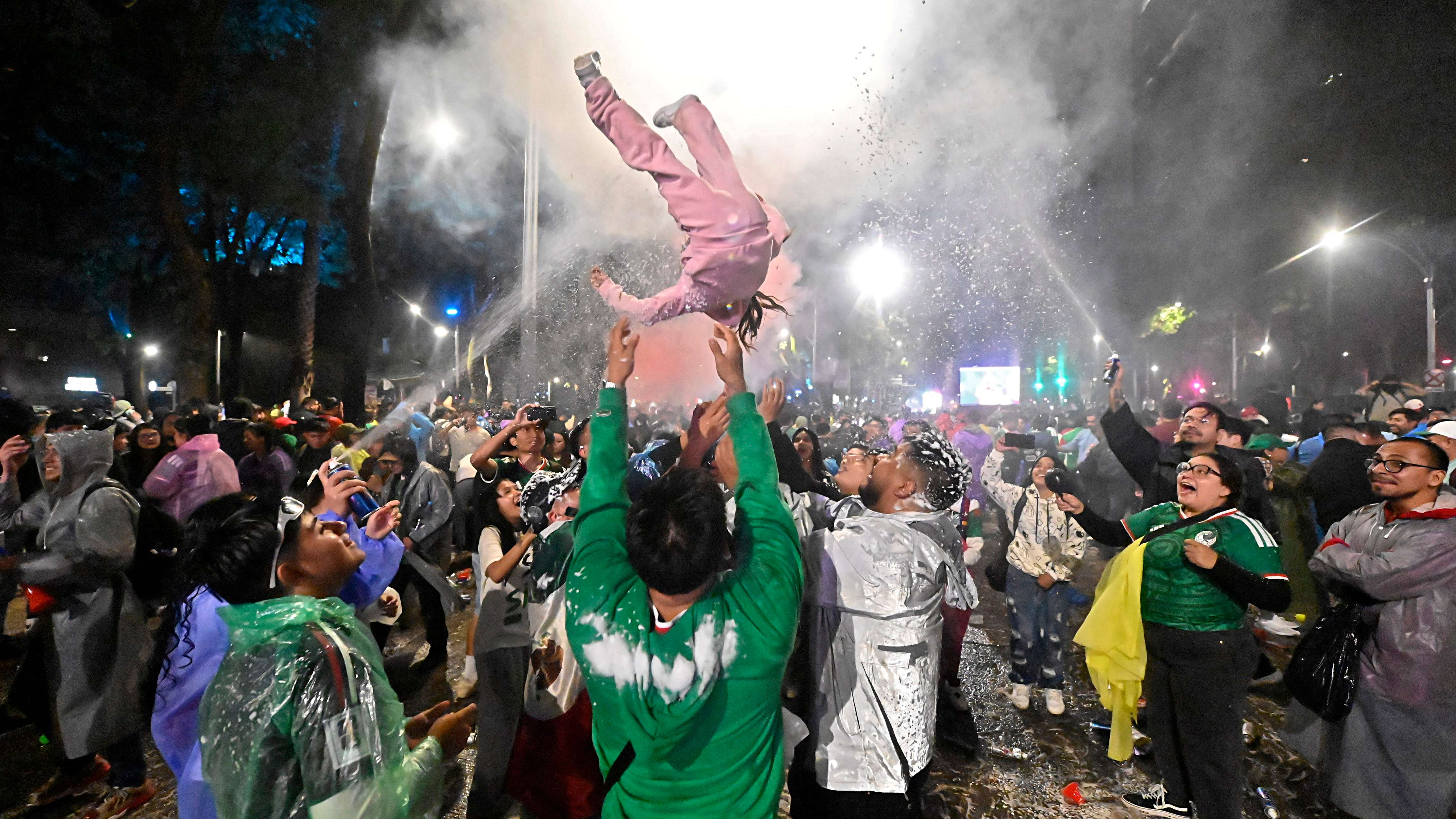Football Fans Watch Mexico v England in the FIFA World Cup in Mexico City