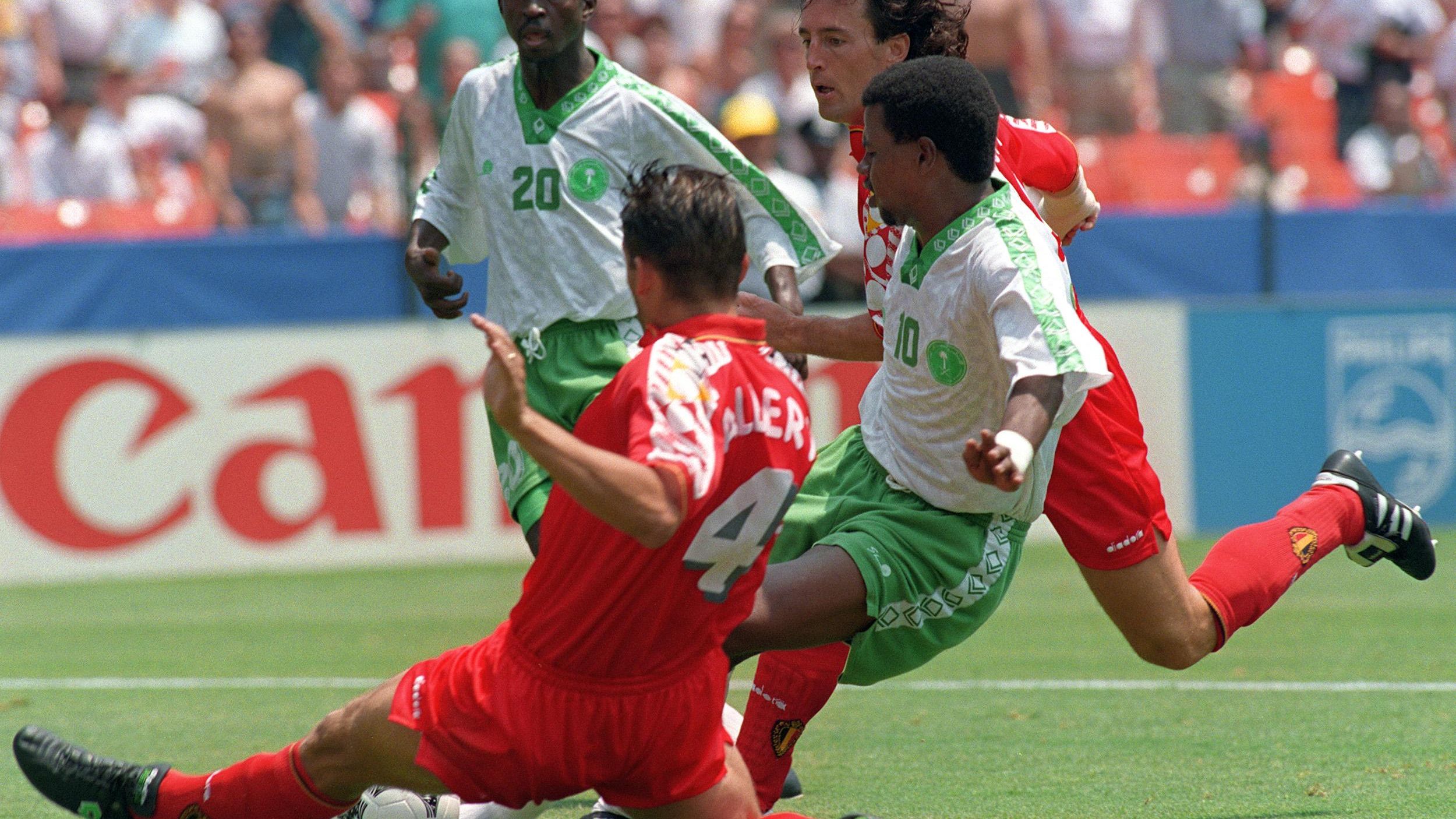 Belgian defender Philippe Albert (4) tries to bloc