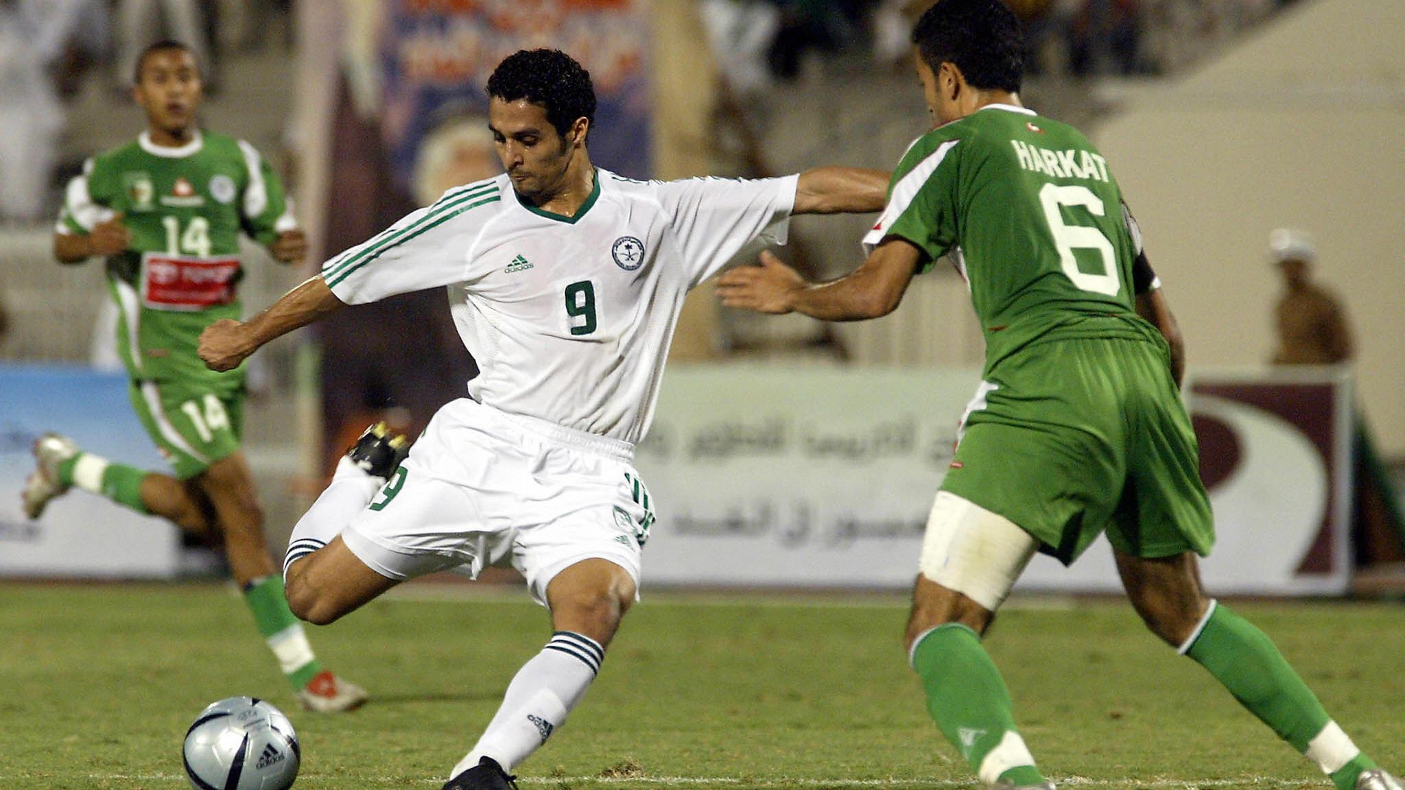 Algerian soccer player Herkat Sufian (R)