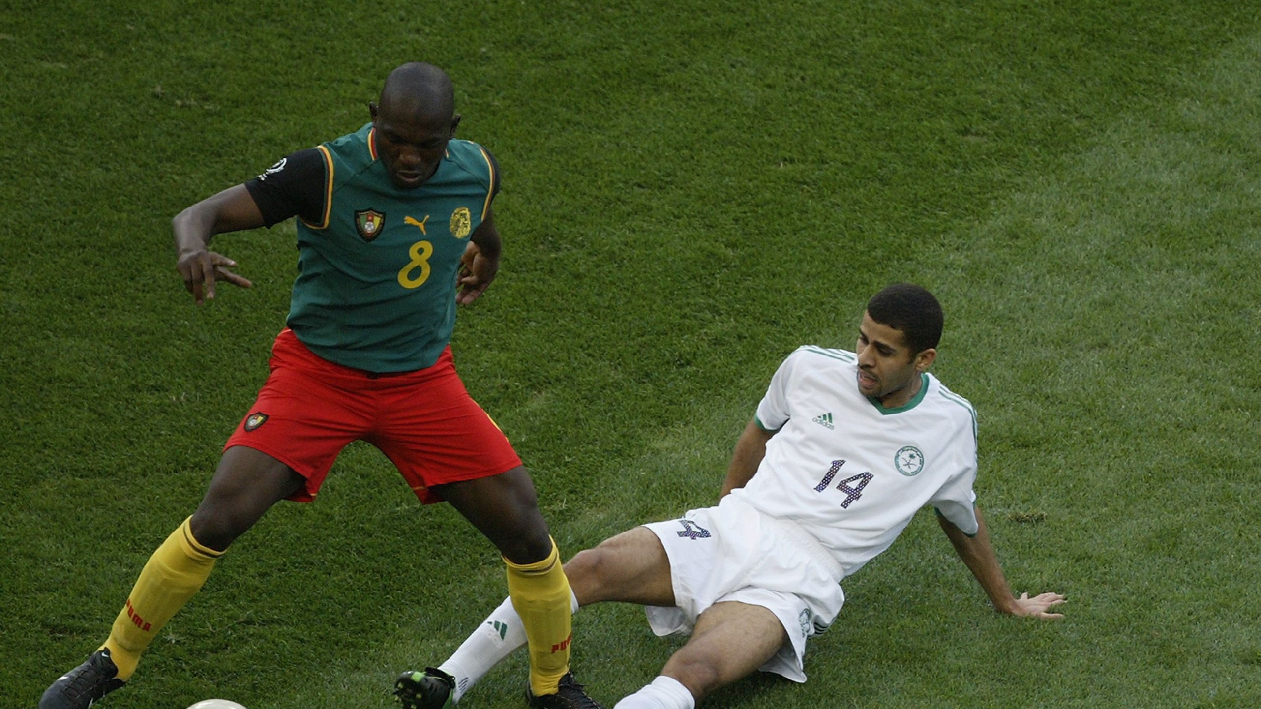 Abdulaziz al Khathran of Saudi Arabia and Geremi of Cameroon