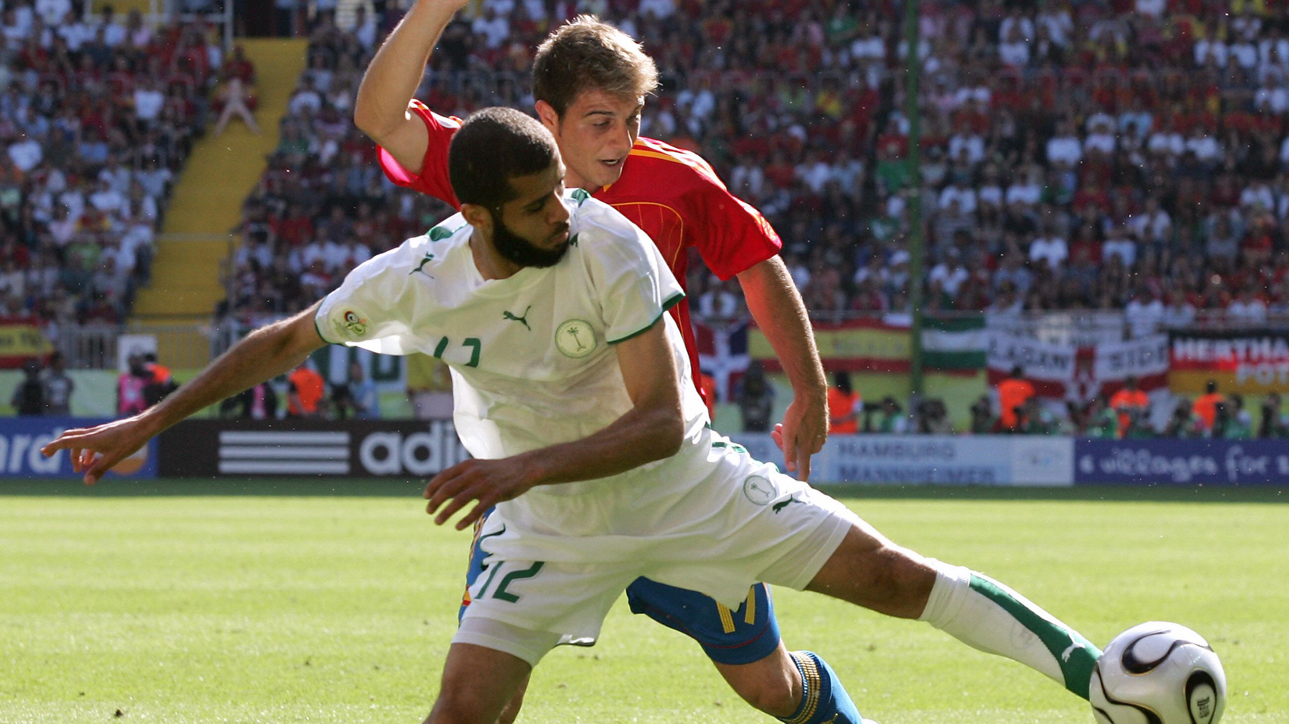 Spanish midfielder Joaquin (behind) vies