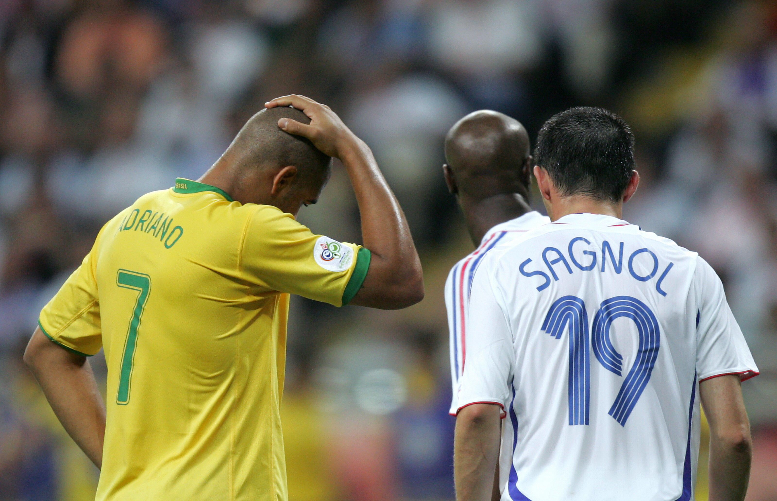 Brazilian forward Adriano (L) reacts as