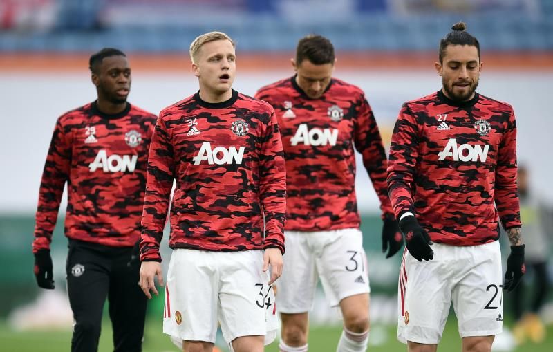 تيليس مع لاعبي مانشستر يونايتد