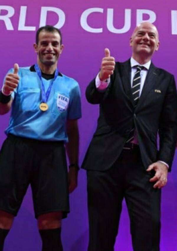 الحكم محمد حسن ورئيس الفيفا