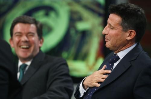 Britain's Minister for Sport, Hugh Robertson, laughs as Sebastian Coe 