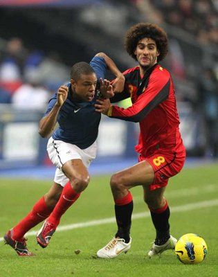 France's Loic Remy (L) and  Marouane Fellaini 
