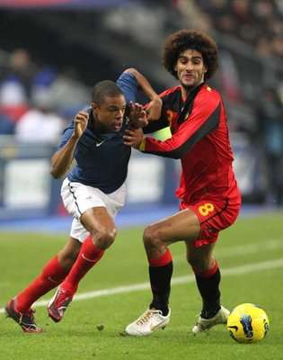 France's Loic Remy (L) and  Marouane Fellaini 
