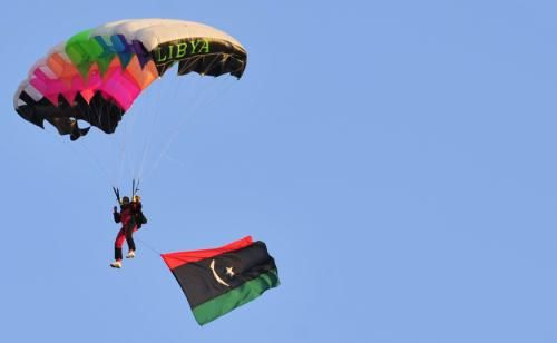 A parachuter descends in the sky 