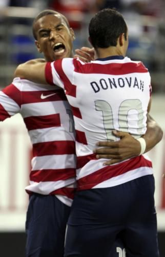 Landon Donovan (R) of the U.S. celebrates