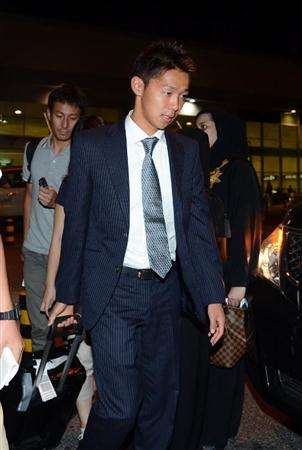 هيروشي كيوتاكي عند وصوله للعاصمة القطرية الدوحة