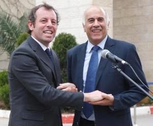 الرجوب وروسيل رئيس برشلونة