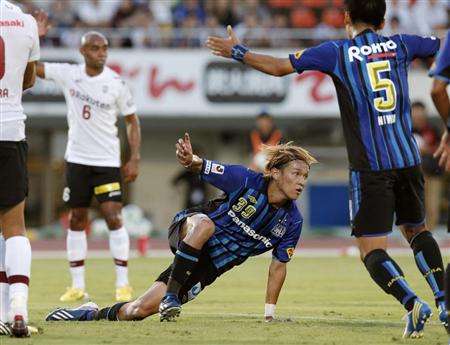 تاكاشي اوسامي بعد تسجيله الهدف الأول