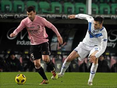 تشيزاري بوفو (يسار )