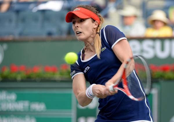 2014-03-12t021114z_848372054_nocid_rtrmadp_3_tennis-bnp-paribas-open-cornet-v-radwanska_reuters