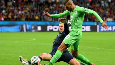 Islam-Slimani-Algeria-is-tackled-by-Manuel-Neuer-Germany-during-match-between-Germany-vs-Algeria-in-Estadio-Beira-Rio-Porto-Alegre-at-World-Cup-2014