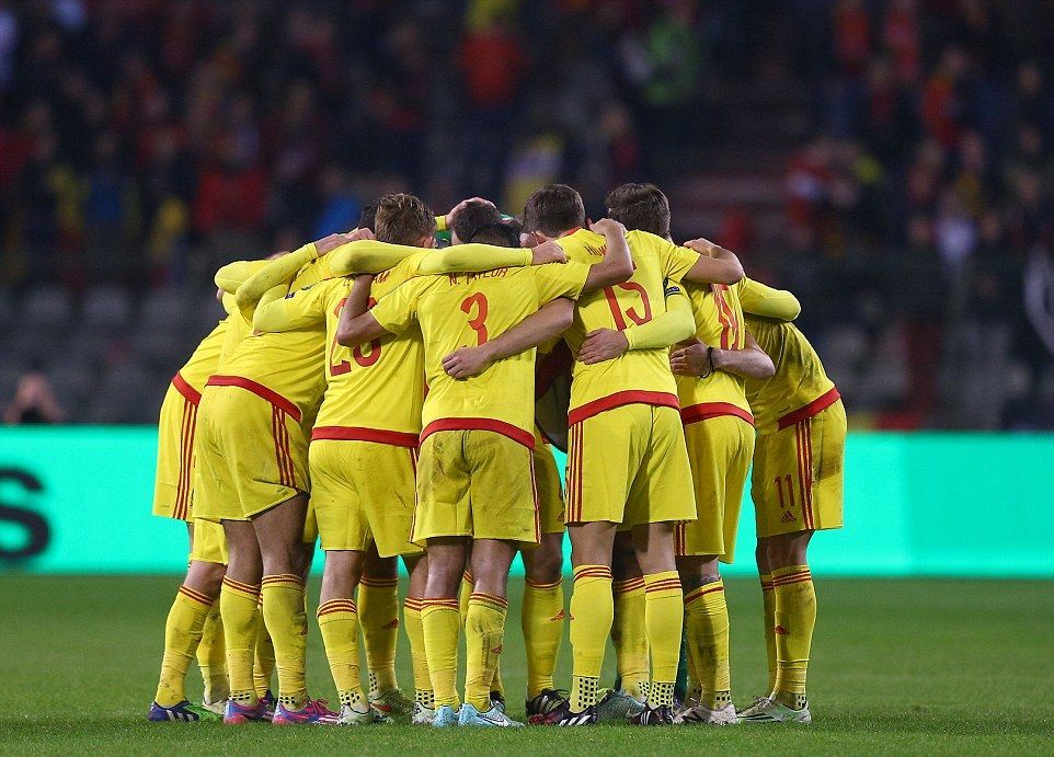 1416165393733_wps_43_The_Wales_team_huddle_tog