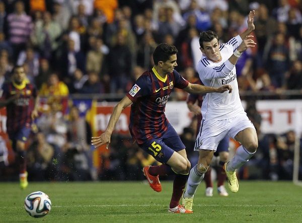 barcelonas-marc-bartra-l-battles-ball-against-real-madrids-gareth-bale-before-bale-scored