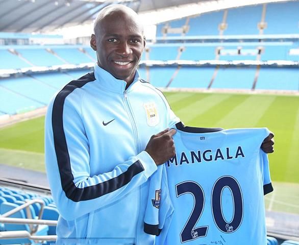 eliaquim-mangala-holding-manchester-city-jersey-2014-2015
