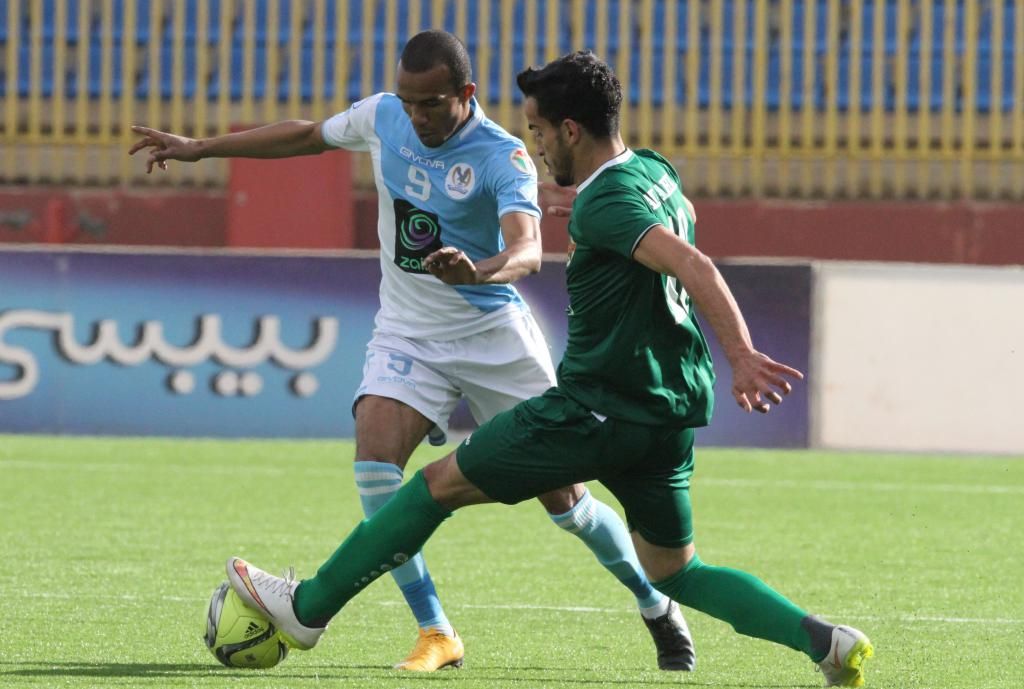 الأهلي هزم الفيصلي وشاركه الصدارة