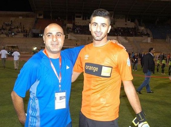 تامر صالح "يمين" مع المدرب ميخائيل