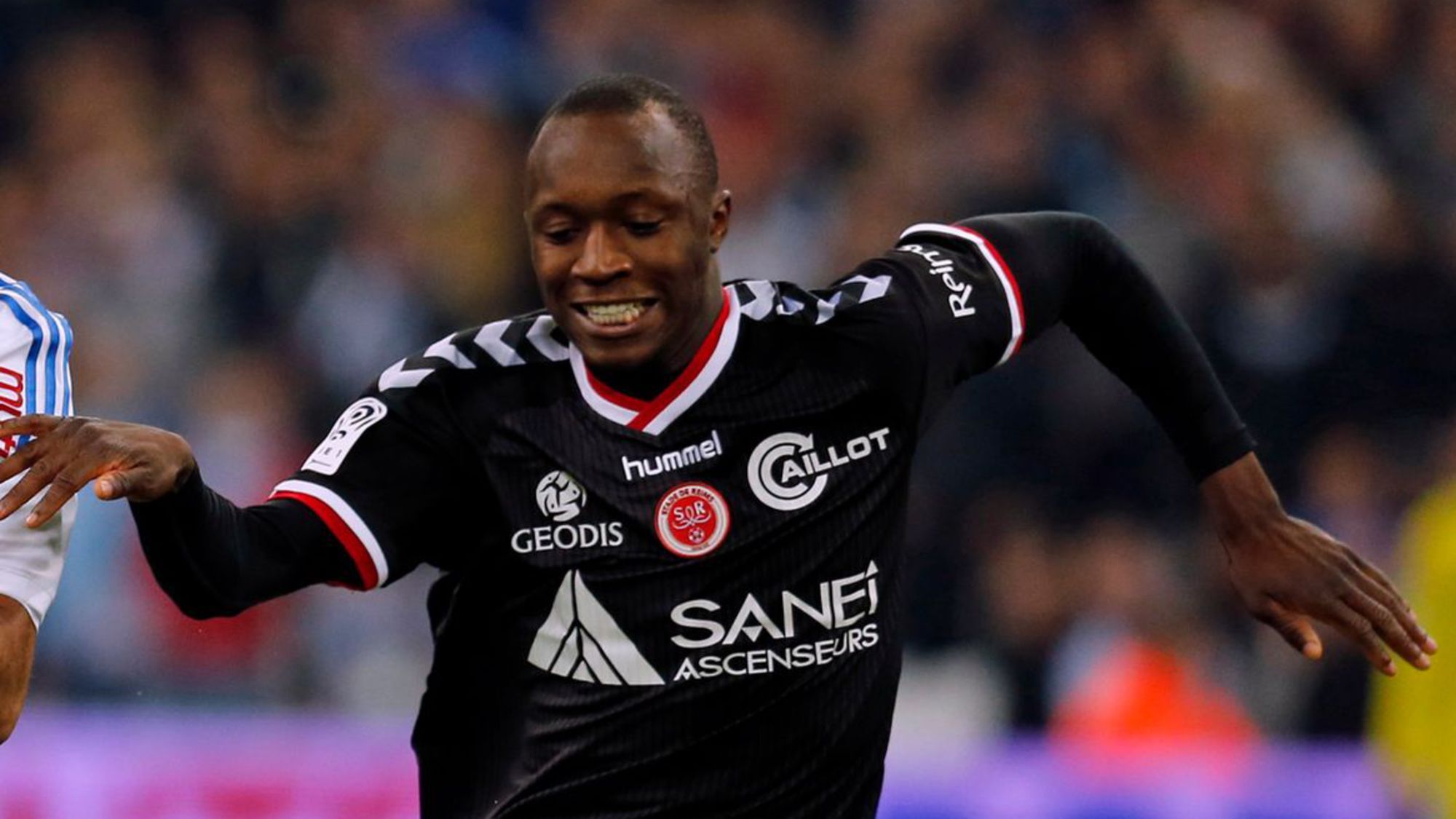 le-joueur-de-reims-antoine-conte-a-dr-lors-d-un-match-contre-marseille-le-13-fevrier-2015-au-stade-velodrome_5761503