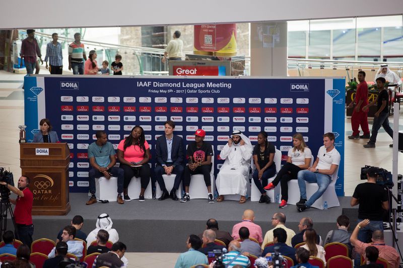 passersby look on as christian  taylor and michelle carter lead  conversation at doha city center mall  event-web