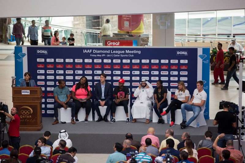 passersby look on as christian  taylor and michelle carter lead  conversation at doha city center mall  event-web