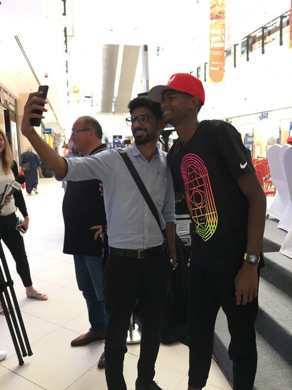 Mutaz%20Barshim%20pausing%20for%20a%20selfie%20%20with%20a%20fan-web