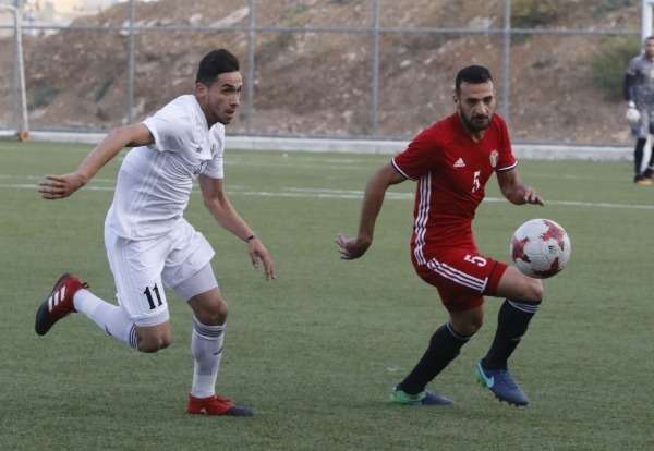 من لقاء المنتخب الأول مع الاولمبي