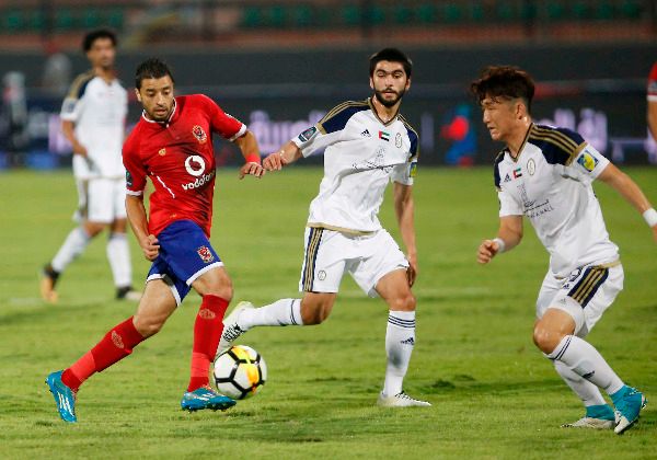 باسم علي (على اليسار)