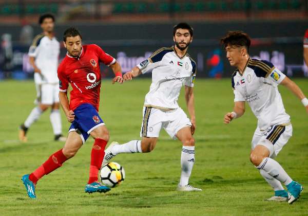 باسم علي (على اليسار)