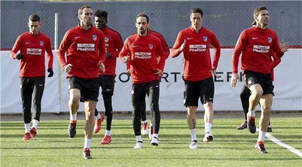 جودين مع لاعبي أتلتيكو