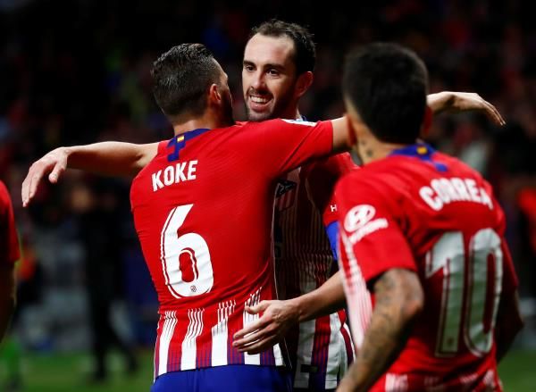 جودين مع لاعبي أتلتيكو