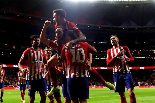 جودين مع لاعبي أتلتيكو