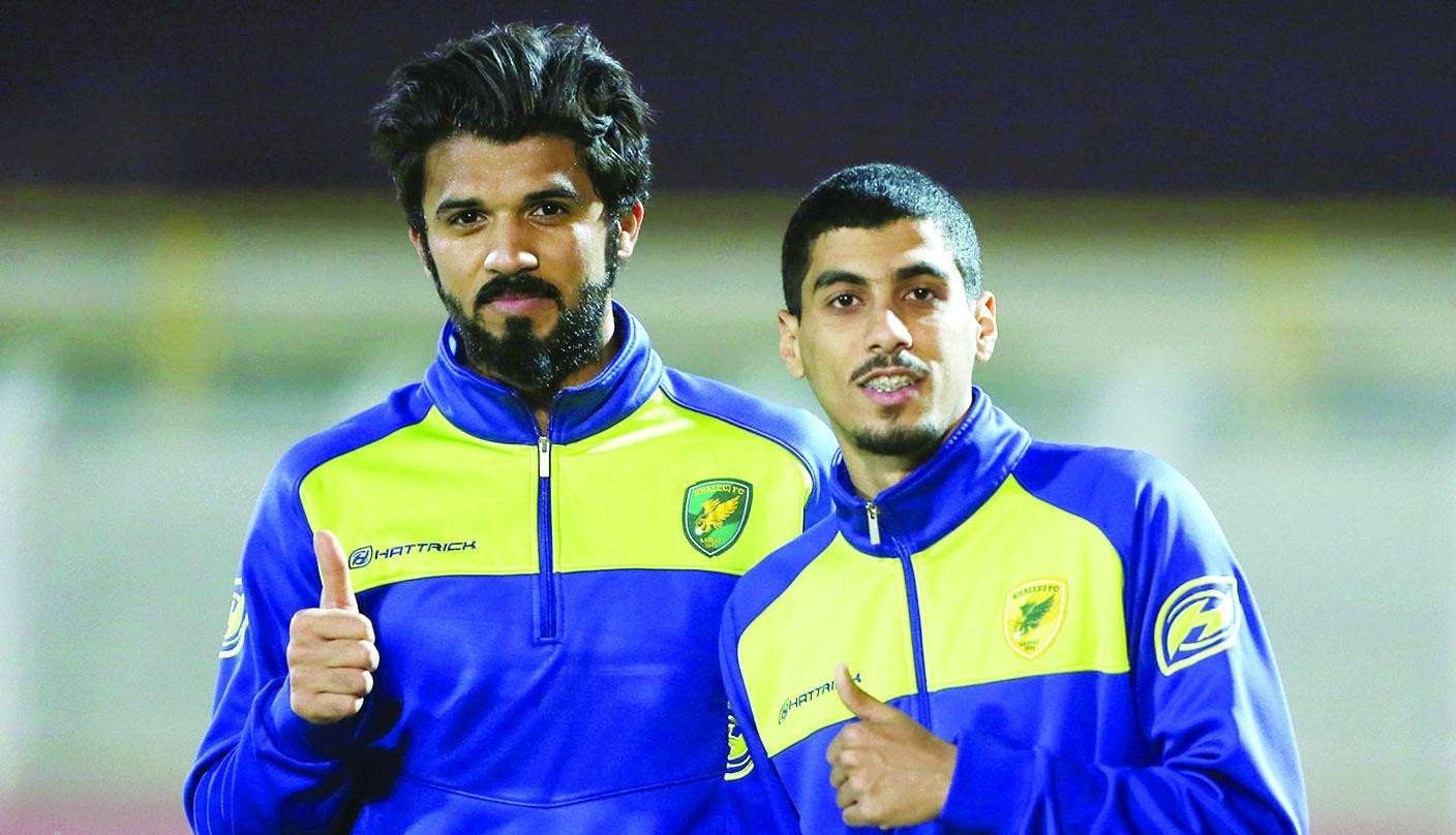 علي لاجامي (على اليمين)