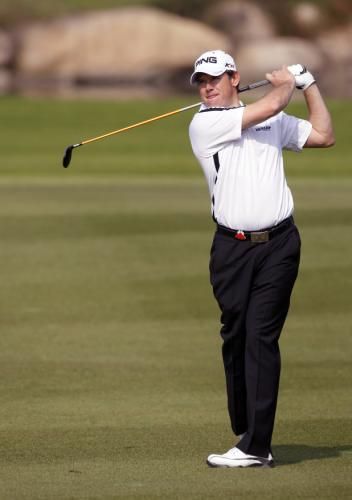 2010-11-04t074614z_01_sha504_rtridsp_3_golf-champions_reuters