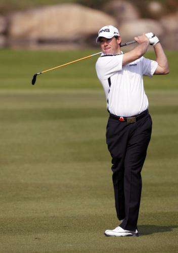 2010-11-04t074614z_01_sha504_rtridsp_3_golf-champions_reuters