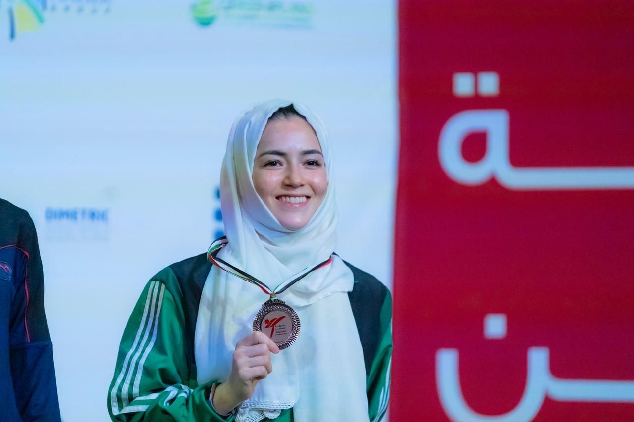 أبرار بخاري مع برونزية بطولة الحسن للتايكواندو