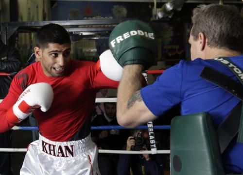  الملاكم خان و مدربه روتش
