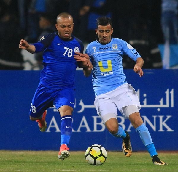 قصي نمر "يسار"