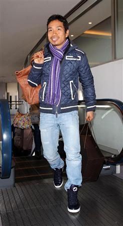 ناغاتومو عند وصوله لمطار ناريتا الياباني