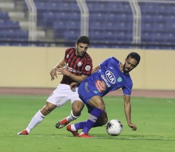 علي الزقعان (على اليمين)